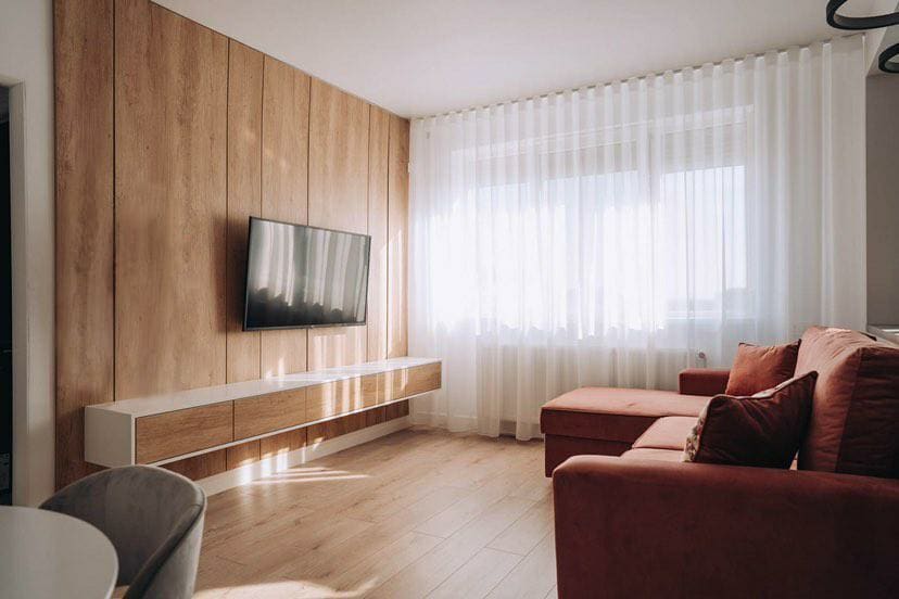 Fully completed living room with oak panelling and bespoke joinery